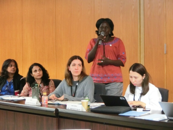 Participant asking questions about victim protection during a lecture on efforts made by local governments